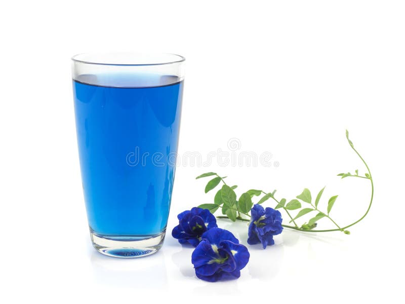 Glass of butterfly pea flower juice on white background