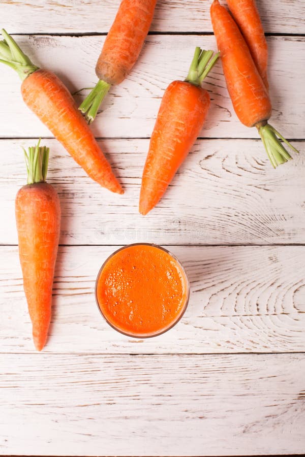 Glass of carrot juice stock photo