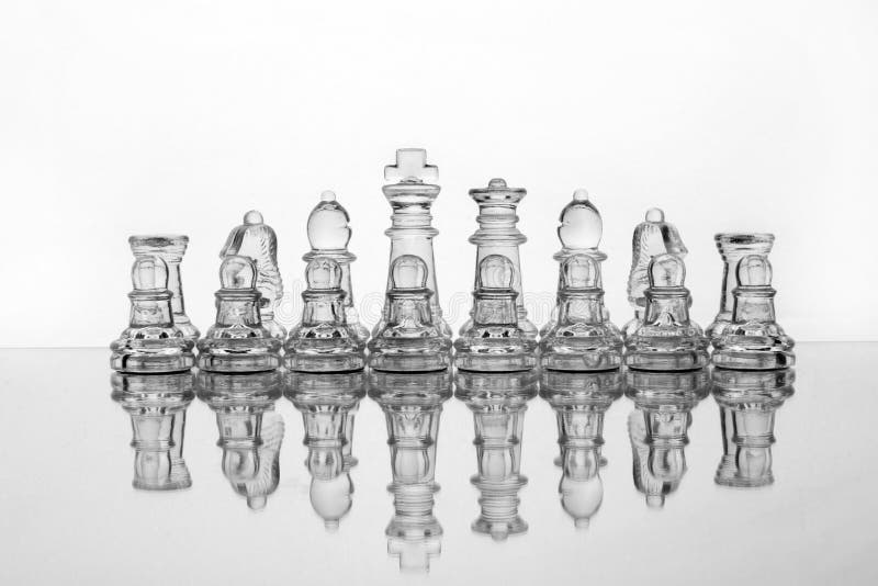 Glass chess pieces royalty free stock photo