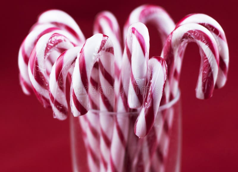 Glass with christmas candy canes.