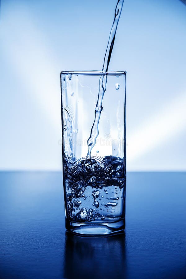 A Glass of Clean Drinking Water Illuminated with Blue Light. Stock ...