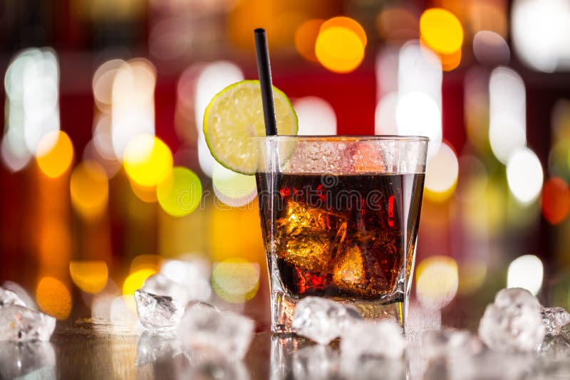 Glass of cola drink on bar counter