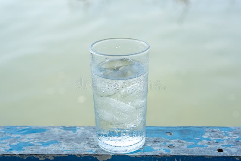 Glass cold water with ice royalty free stock images