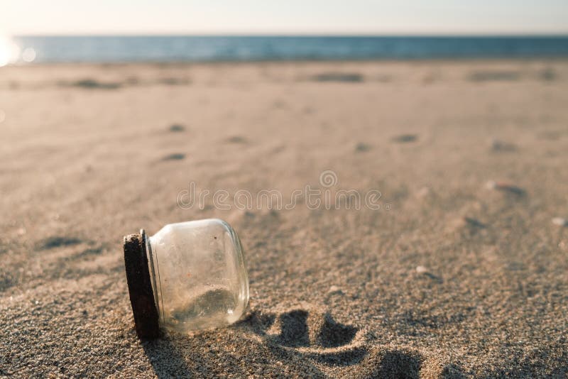Glass Container Jar Trash on Sandy Sea Coast, Polluted Ecosystem