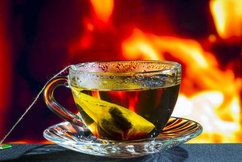Glass Transparent Cup on the Background of Fire Fire Stock Image
