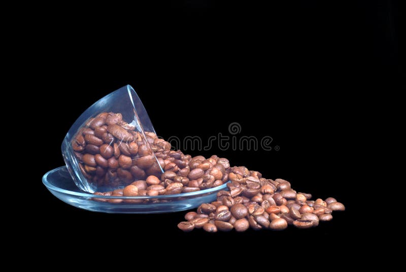 Glass cup cofee beans on a black background