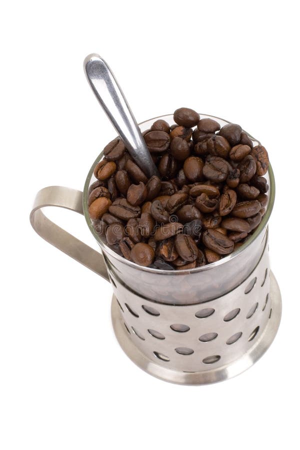 Glass cup with coffee and beans isolated on white