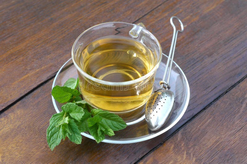 Glass Cup of Mint Tea with Mint Leaves and Tea Holder Spoon Stock Image ...