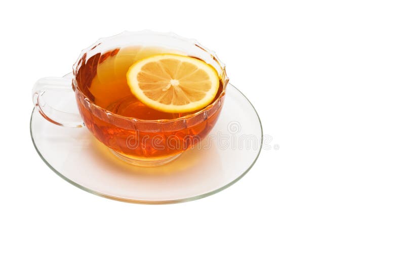 Glass cup with tea and a lemon