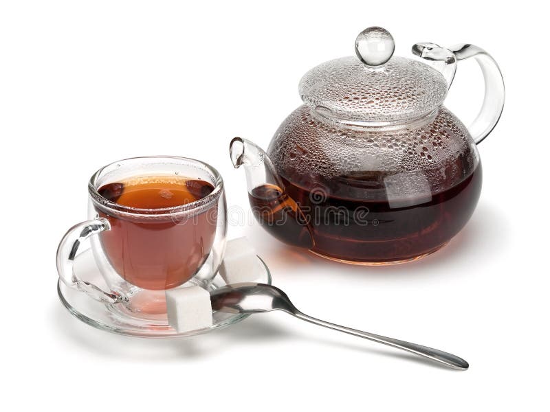 Glass a cup with tea and a teapot