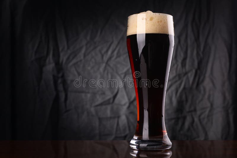 Glass of dark beer stock photo. Image of froth, lager 80207270