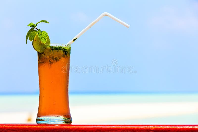 Glass of Drink is on a Beach Table Stock Image Image of ocean, straw