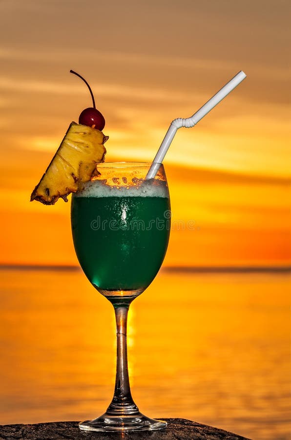 Glass of Drink is on a Beach Table Stock Photo Image of ocean, orange
