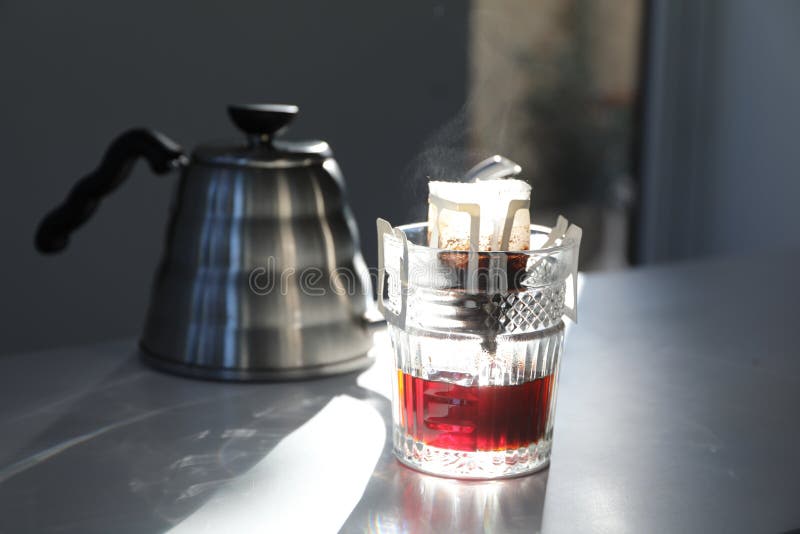 Glass with Drip Coffee Bag and Kettle on Light Grey Table Stock Image Image of instant