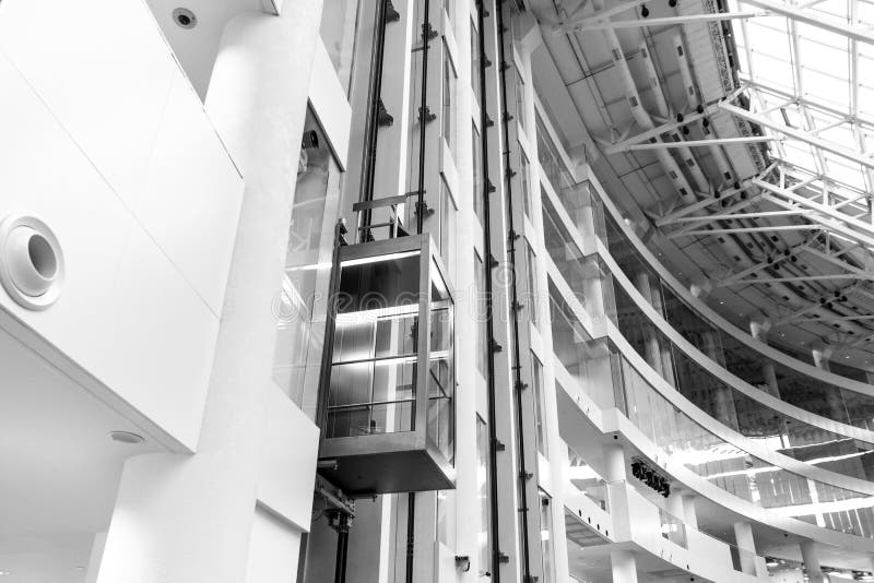 Glass Elevator in Office Building in Black and White Color, Elev Stock