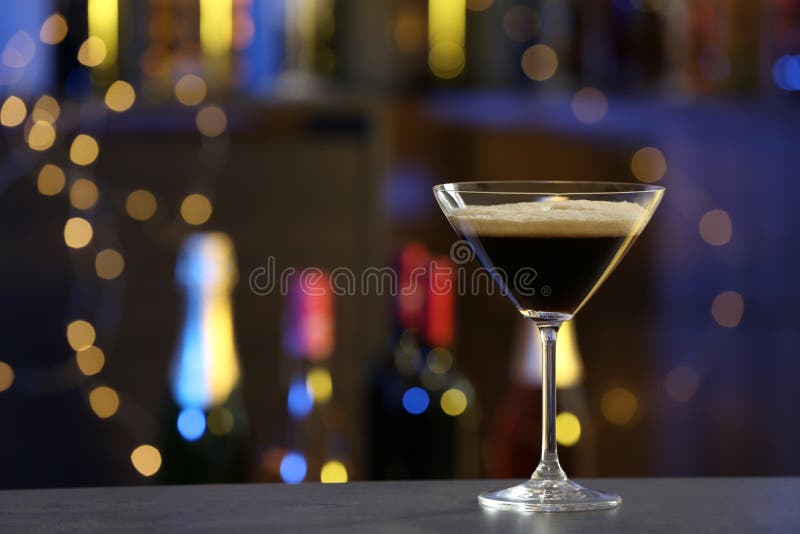 Glass of Espresso Martini on Counter in Bar. Alcohol Cocktail Stock