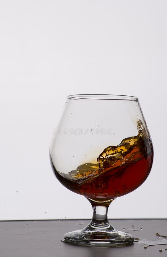 Glass of expensive cognac stock image. Image of cognac 85568277
