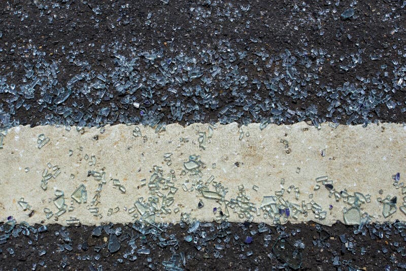 Glass falls on the road and broken. The shattered glass was spread out on the road. It be come dangerous must be careful while dri royalty free stock photography Glass falls on the road and broken. The shattered glass was spread out on the road. It be come dangerous must be careful while dri royalty free stock photography