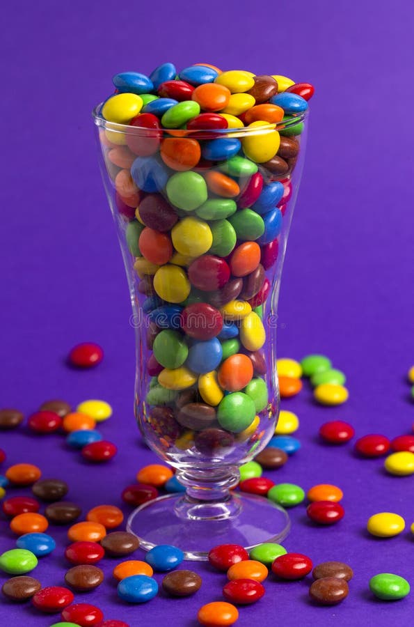 Glass Filled with Rainbow Colored Candy Coated Chocolate Buttons Stock Image Image of colorful