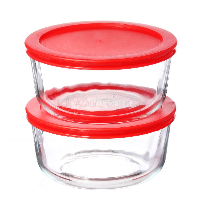 Glass food containers with red plastic lids isolated on white royalty free stock photo