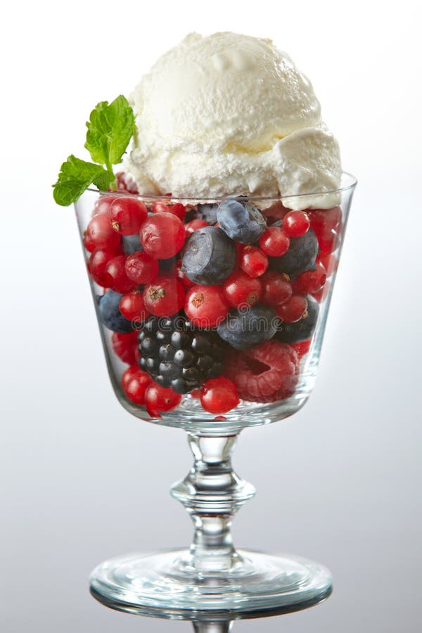 Glass of fresh berries with ice cream