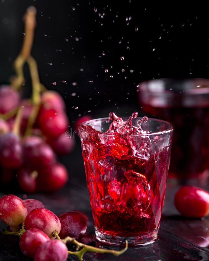 A Glass of Fresh Grape Juice, Grape Juice Canning. Dark Background