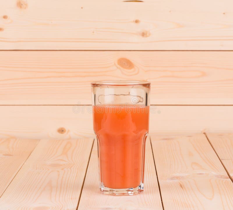 Glass full of tasty fresh grapefruit juice. stock image Glass full of tasty fresh grapefruit juice. stock image
