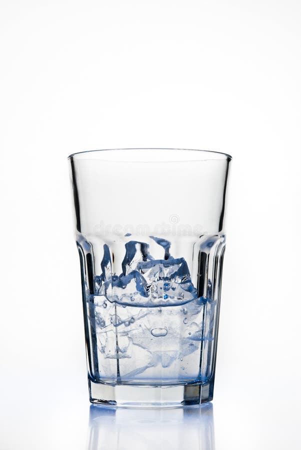 Glass with ice cubes stock photos