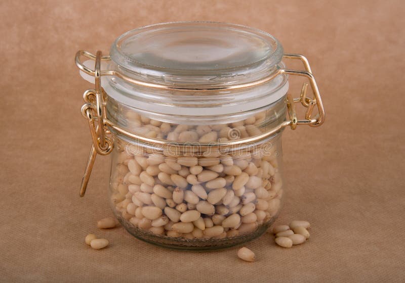Glass jar of cedar nuts stock image. Image of dieting 55770967