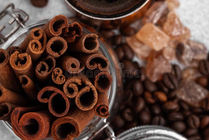 Glass Jar with Cinnamon Sticks with Roasted Beans Top View Stock Photo
