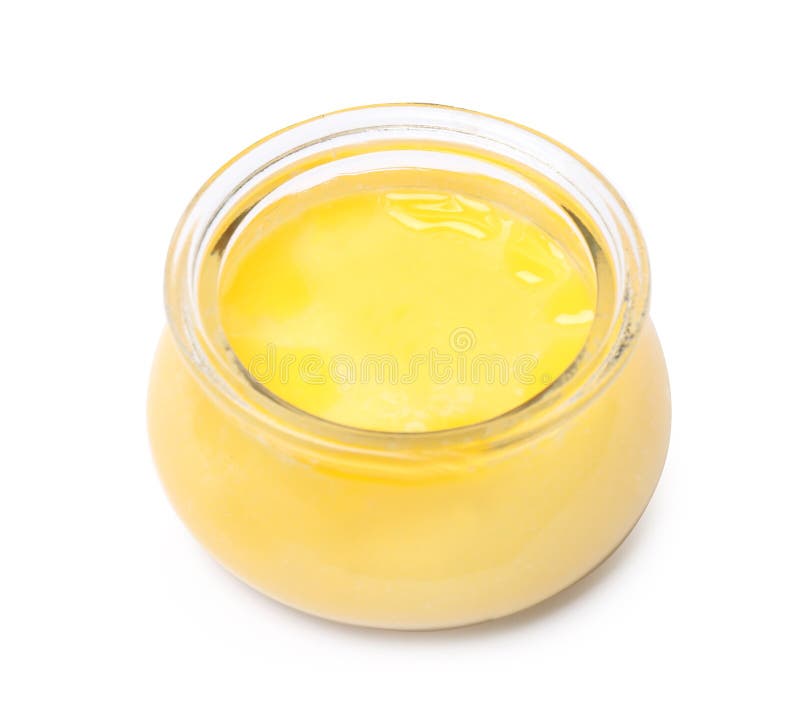 Glass Jar of Clarified Butter Ghee with Wooden Spoon Stock Photo