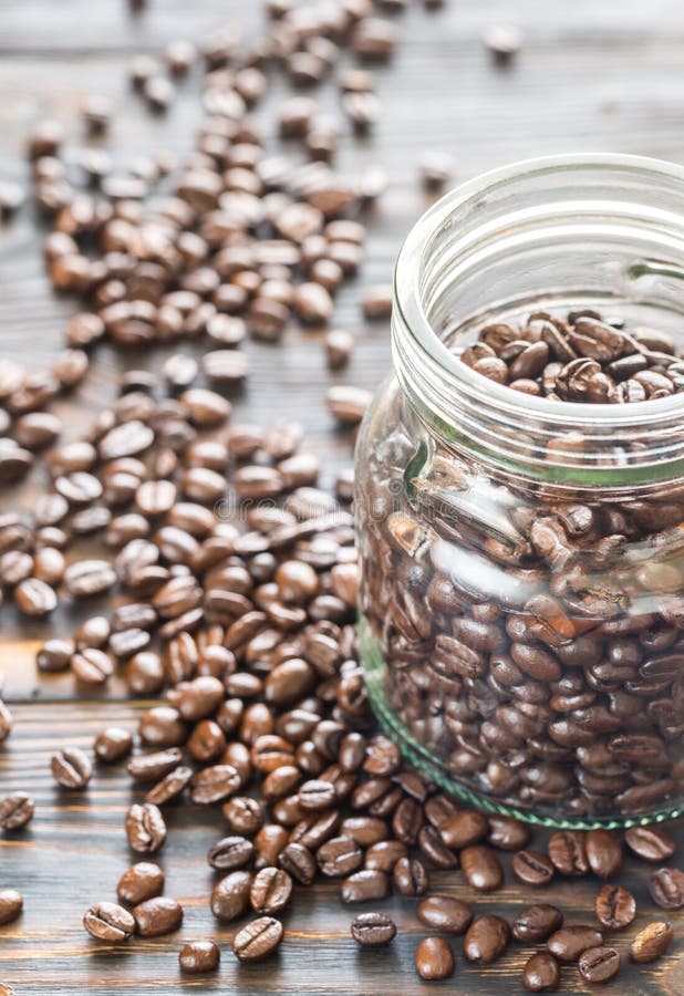 Glass jar of coffee beans stock image. Image of black 89344249