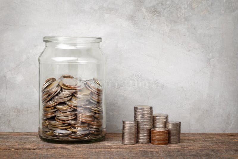 Glass jar with coins.