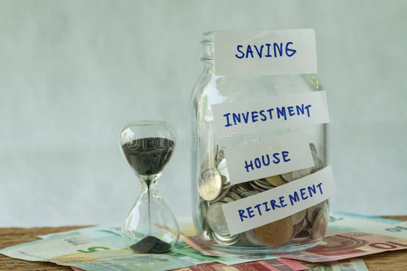 glass jar with full of coins with labeled as saving, investment, house, retirement with sandglass on Euro banknotes as long term