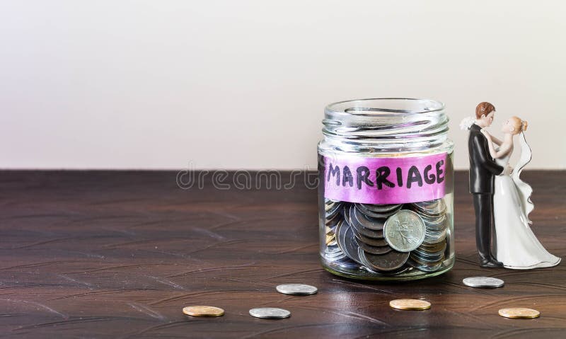 Glass jar full of coins and Marriage is Labelled.