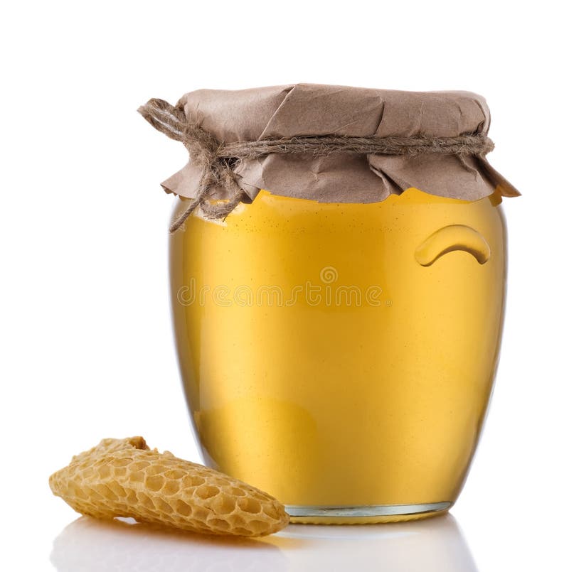 Glass Jar Full of Honey and Wooden Stick on a White Background Stock