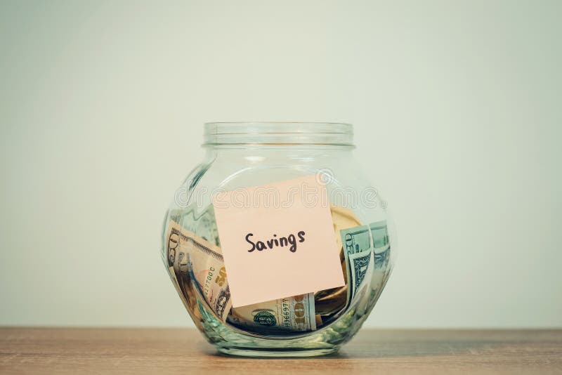 Glass Jar Full of US Dollars Money on the Shelf Stock Photo Image of