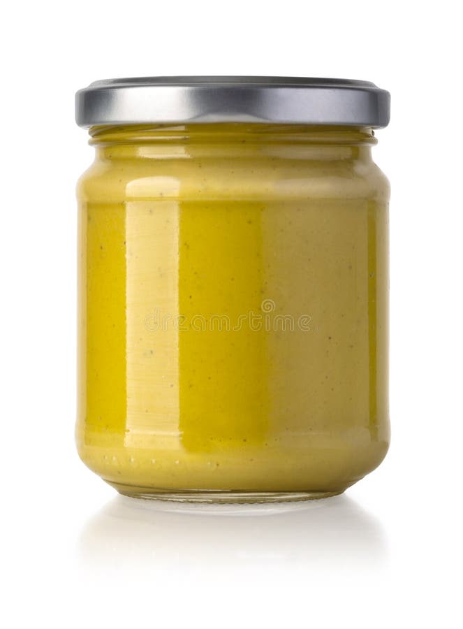 Glass jar of mustard royalty free stock photo