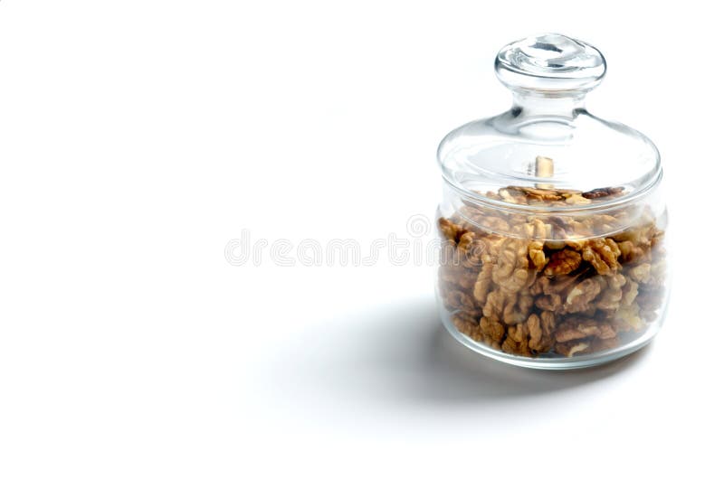 Glass Jar with Nuts on a White Background, Horizontal Orientation