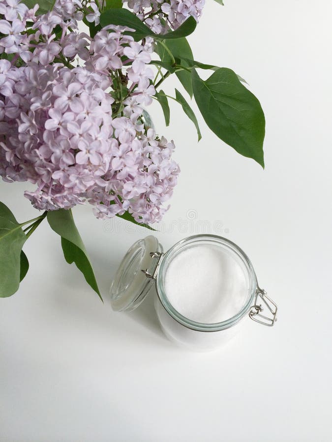 Glass jar of sugar and fresh lilac flowers. Glass jar of sugar and fresh lilac flowers