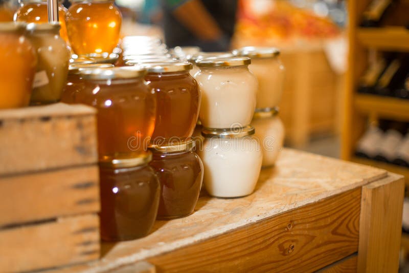 Glass jars of honey stock image. Image of grown, large 137942209