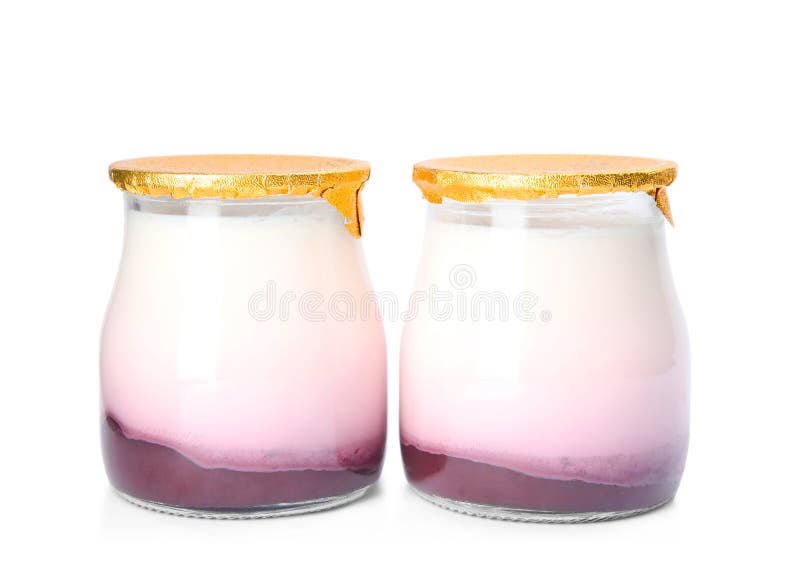 Glass jars of tasty fruit yogurt on white royalty free stock photo Glass jars of tasty fruit yogurt on white royalty free stock photo