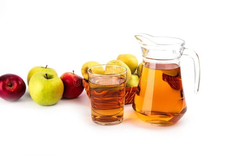 Glass and a jug of apple juice , on white background