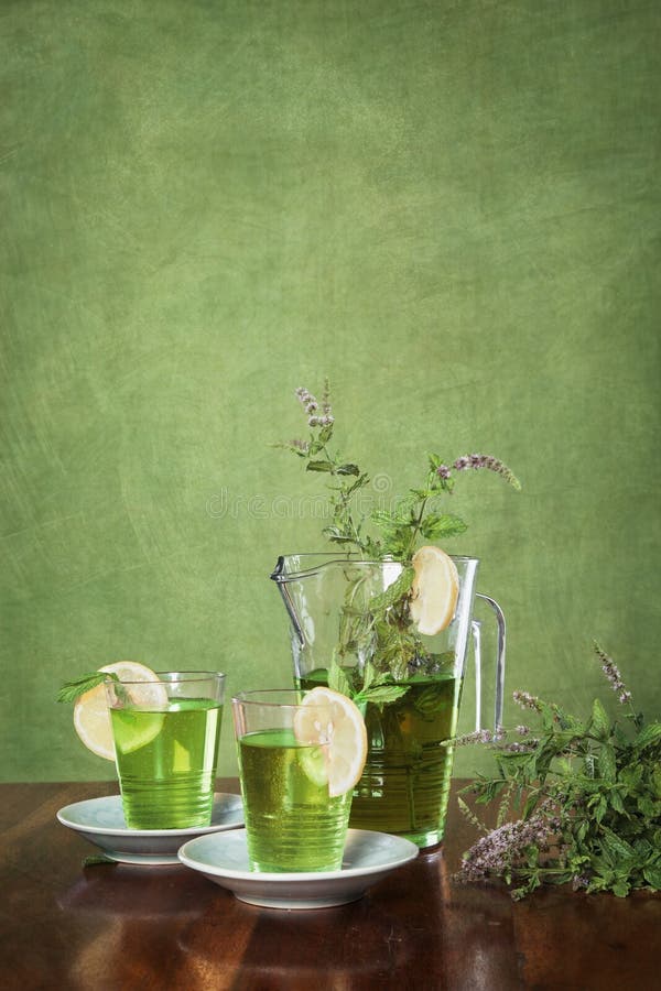 Glass jug with green tea stock photo. Image of cold, leaf 63721008