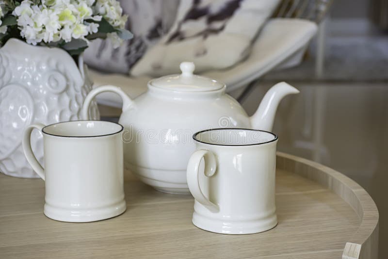 Glass and Kettles is Made from Ceramic Tile on a Wooden Table Stock