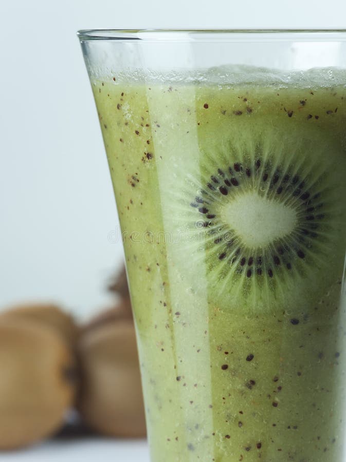 A glass of kiwi Juice with slices and fruits royalty free stock photos A glass of kiwi Juice with slices and fruits royalty free stock photos