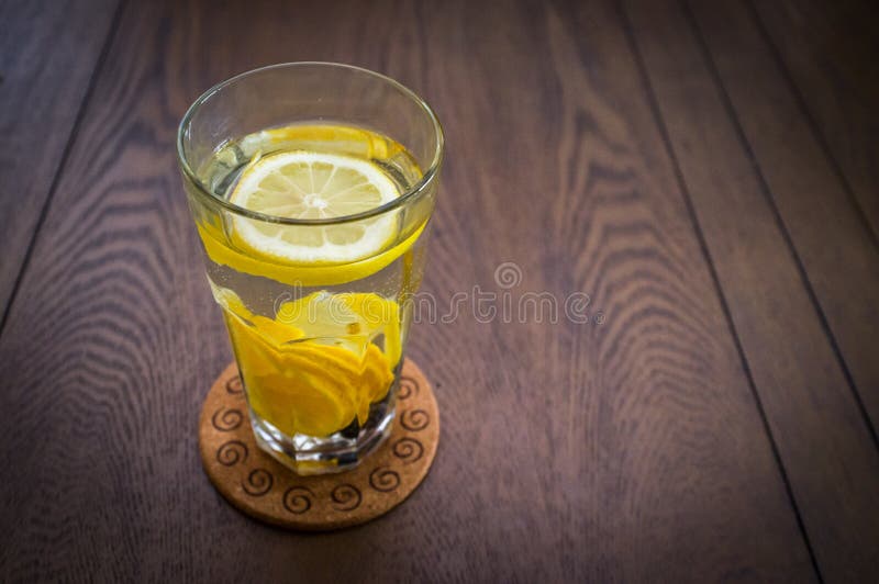 Glass of Lemon Water stock photo. Image of drinking, coaster 73922772