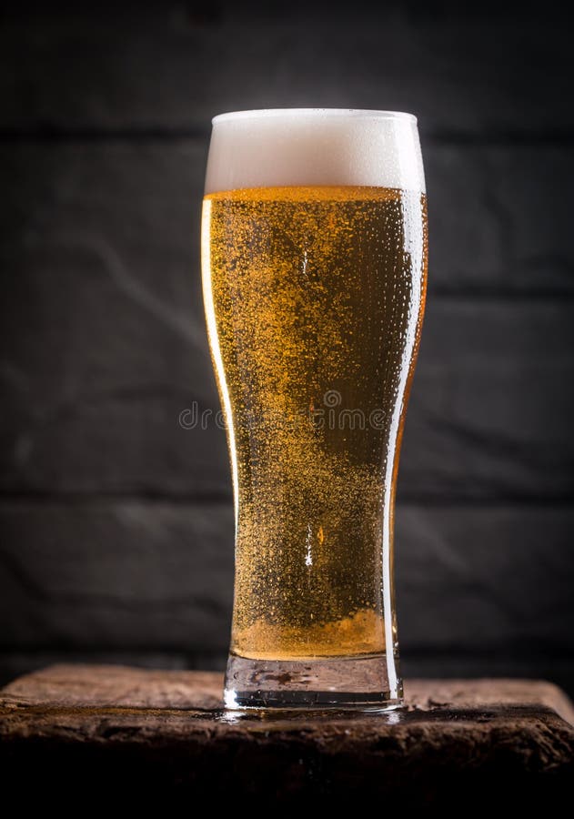 Glass of light beer stock photo. Image of celebration 81367514