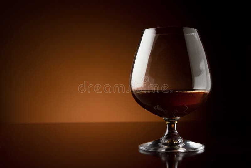 Glass of luxury cognac with copy space