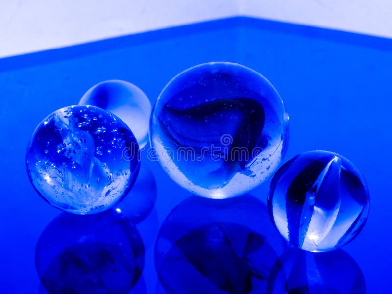 Colored Clear Glass Marbles. Stock Photo Image of childish, blue